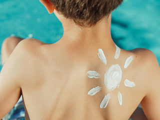 Sheer zinc oxide sunscreen being applied for a no-white-cast finish on skin